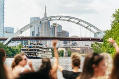Nashville: Pontoon Party Cruise with a Captain - Boarding at the Dock: Bridge Building and the Red Sculpture